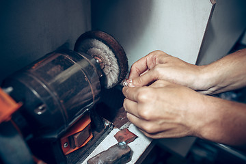 Image showing Different goldsmiths tools on the jewelry workplace. Jeweler at work in jewelry.