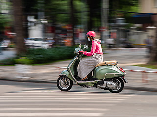 Image showing Woman on scooter in Ho Chi Minh City