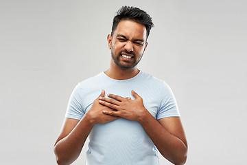 Image showing unhappy indian man suffering from heartache