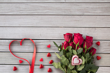 Image showing close up of red roses and heart shaped candies