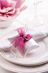 Image showing Beautiful table setting with small present for the guest