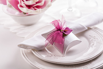 Image showing Beautiful table setting with small present for the guest