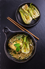 Image showing Thai green curry chicken soup with pak choi