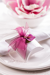 Image showing Beautiful table setting with small present for the guest