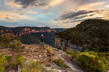 Image showing Female takes in the magnificent mountain valley views