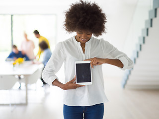 Image showing Portrait of  black casual businesswoman using tablet  with cowor