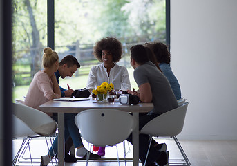 Image showing Multiethnic startup Business Team At A Meeting at modern office 