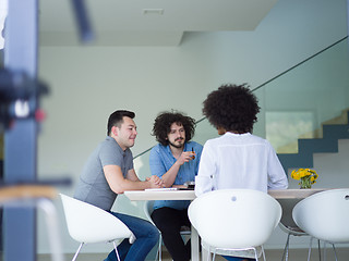 Image showing Multiethnic startup Business Team At A Meeting at modern office 