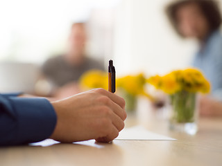 Image showing Business man hand holding pen