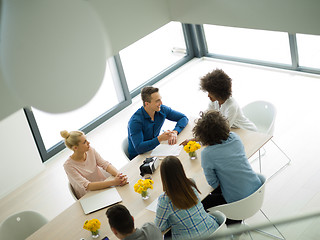 Image showing Multiethnic startup Business Team At A Meeting at modern office 