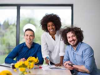 Image showing Multiethnic startup Business Team At A Meeting at modern office 