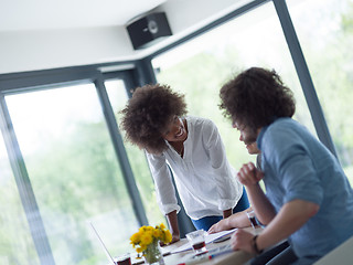 Image showing Multiethnic startup Business Team At A Meeting at modern office 