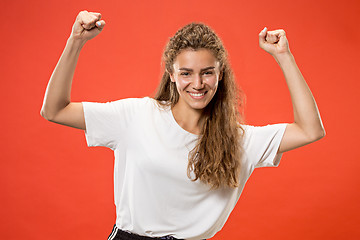 Image showing Winning success woman happy ecstatic celebrating being a winner. Dynamic energetic image of female model