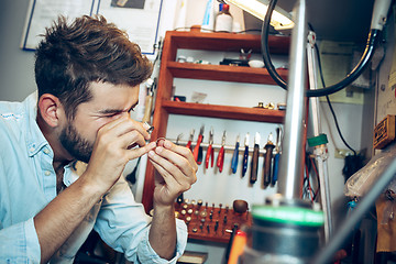 Image showing Different goldsmiths tools on the jewelry workplace. Jeweler at work in jewelry.