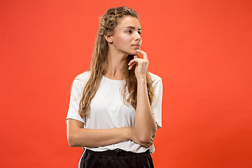 Image showing Young serious thoughtful woman. Doubt concept.