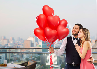 Image showing couple with heart shaped balloons in singapore