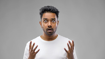 Image showing shocked indian man over grey background