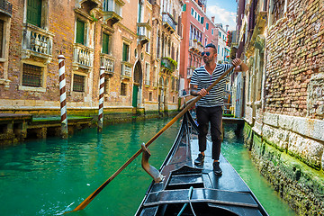 Image showing Gondolier on canal of venice