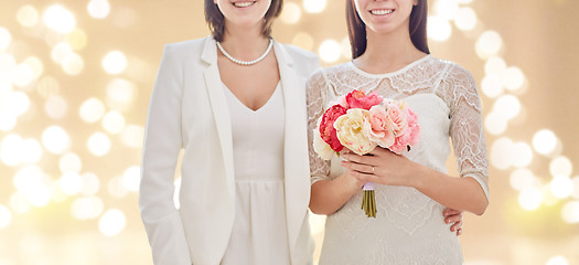 Image showing close up of happy lesbian couple with flowers