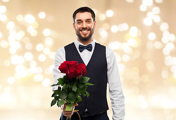 Image showing happy man with bunch of red roses