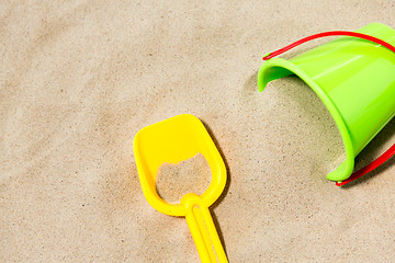 Image showing close up of toy bucket and shovel on beach sand