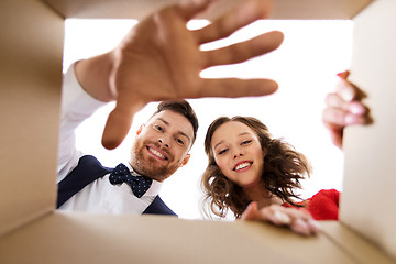 Image showing happy couple opening christmas gift box