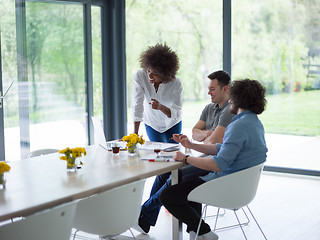 Image showing Multiethnic startup Business Team At A Meeting at modern office 