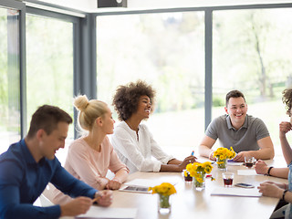 Image showing Multiethnic startup Business Team At A Meeting at modern office 