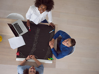 Image showing top view of Multiethnic startup business team on meeting