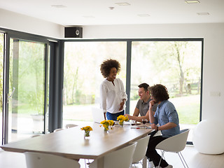 Image showing Multiethnic startup Business Team At A Meeting at modern office 