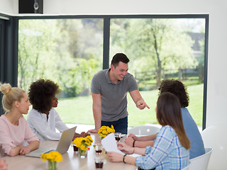 Image showing Multiethnic startup Business Team At A Meeting at modern office 