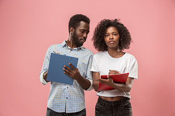 Image showing Two african students with folders in t-shirts together. Stylish girl with Afro hairstyle and her boyfriend.