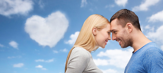 Image showing couple forehead to forehead over festive lights