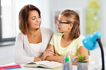 Image showing mother and daughter doing homework together