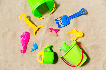 Image showing close up of sand toys kit on summer beach