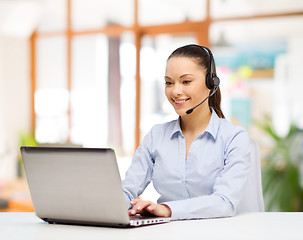 Image showing helpline operator in headset working at office