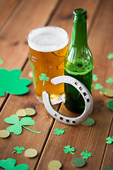 Image showing glass of beer, bottle, horseshoe and gold coins