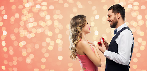 Image showing man giving woman engagement ring on valentines day