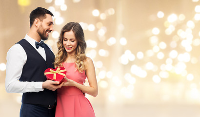 Image showing happy couple with gift on valentines day