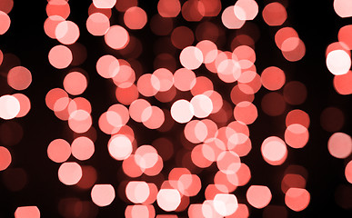 Image showing blurred bokeh lights in living coral color