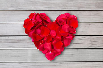 Image showing close up of red rose petals in heart shape