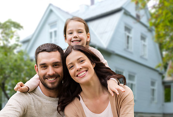 Image showing happy family over house background