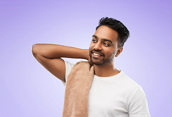 Image showing indian man with towel over violet background