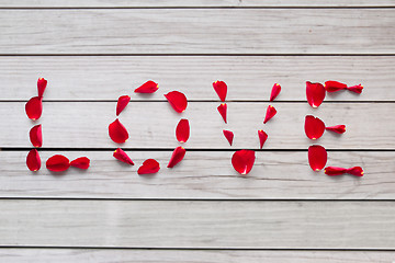 Image showing word love made of red rose petals