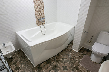 Image showing Interior of a large bathroom combined with a toilet