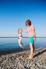 Image showing Woman play with her dog