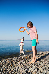 Image showing Woman play with her dog