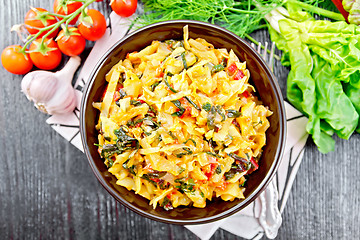 Image showing Cabbage stew with chard in bowl on dark board top