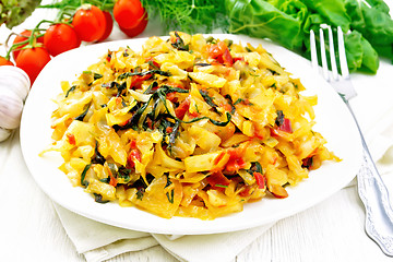 Image showing Cabbage stew with chard in plate on light board