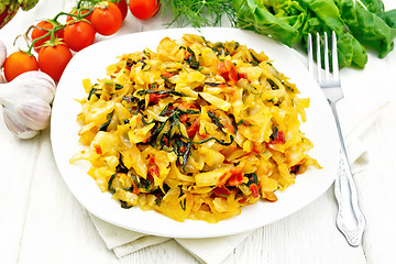 Image showing Cabbage stew with chard in plate on board